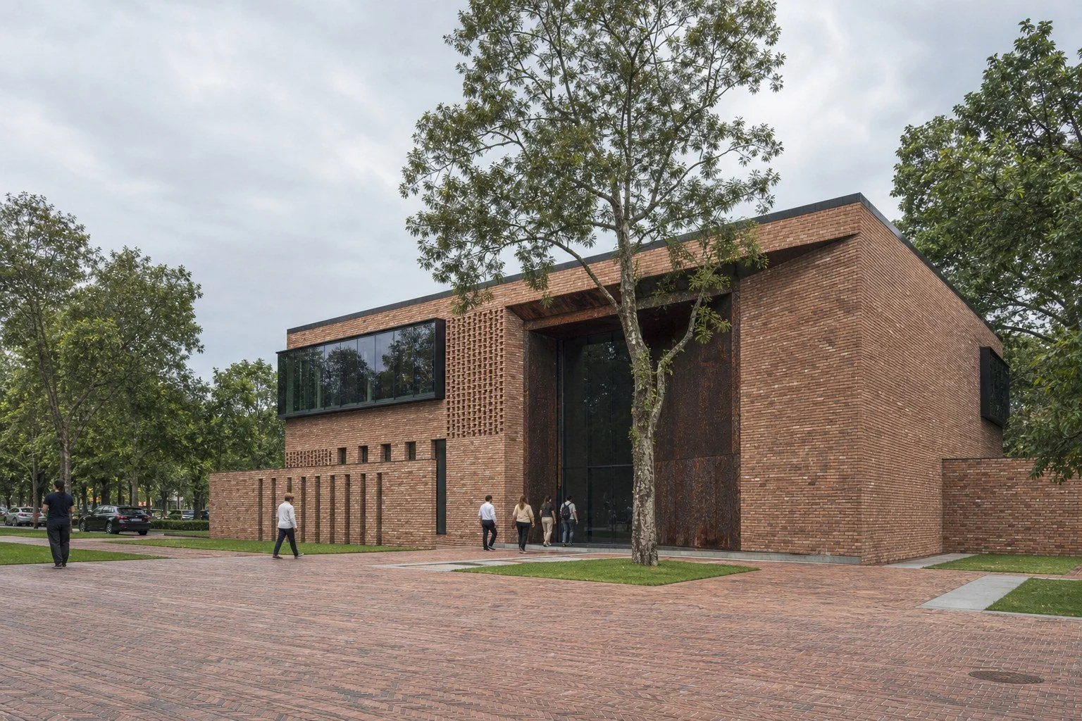 Brick Yard entrance courtyard with a retained tree